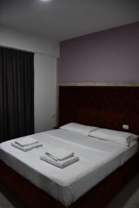 Postel nebo postele na pokoji v ubytování Apartamente Antoni Shengjin
