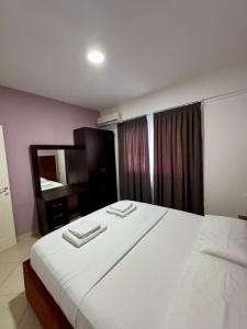 Postel nebo postele na pokoji v ubytování Apartamente Antoni Shengjin