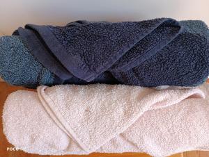 a pile of towels sitting on top of a table at Ostal Arriatge in Lézat-sur-Lèze