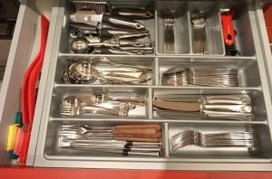 a drawer full of utensils in a box at 3,5 Zimmer Parterre Wohnung in Alpnach