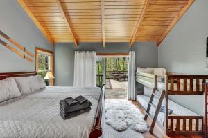 a bedroom with a bed and a wooden ceiling at Secluded 3BR Home Fire Pit Covered Deck in Salamanca