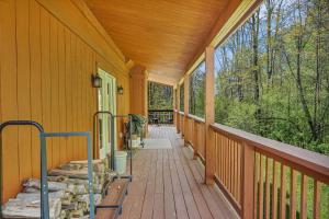 an empty porch of a home with a wooden deck at Secluded 3BR Home Fire Pit Covered Deck in Salamanca +53 photos