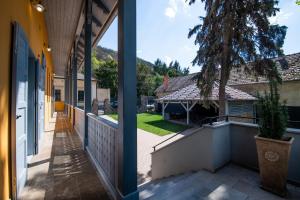 two views of a house from the balcony of a house at Anna Vendégház in Visegrád