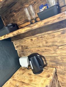 a toilet sitting on top of a wooden wall at Discreet Kinks in Newport