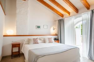 Postel nebo postele na pokoji v ubytování Hotel Rural Binigaus Vell + 37 fotografií