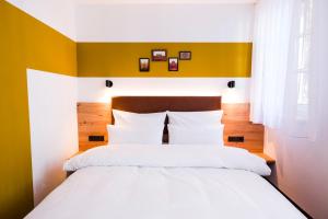 Voodi või voodid majutusasutuse Hotel Sandkorn toas