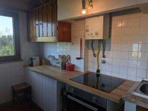 a kitchen with a sink and a counter top at 4Sea House in Porto Covo