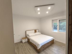 Postel nebo postele na pokoji v ubytování Apartments Villa Tanja