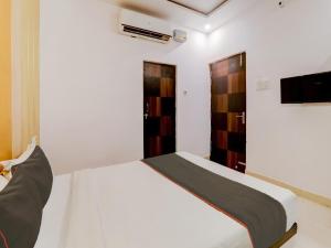 Postel nebo postele na pokoji v ubytování Collection O Kiara Guest House