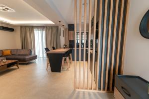 a living room with a couch and a table at Aurora Apart, 4 - Sea view suites near the beach in Marmari