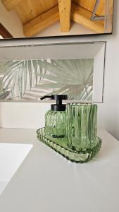 a bathroom sink with a green glass faucet at Alla Rocca Storica in Cavallino-Treporti +231 photos