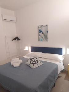 Posteľ alebo postele v izbe v ubytovaní Le Rocce Holiday Rooms