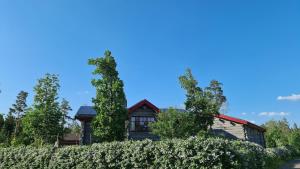 a house with trees in front of it at 1 Lägenhet med 2 sovrum och kök in Österbybruk