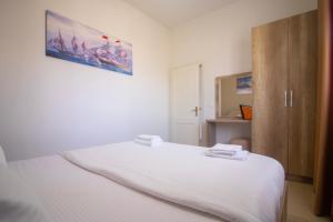 Postel nebo postele na pokoji v ubytování Hotel Princ
