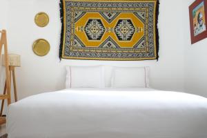 A bed or beds in a room at chez Aissam