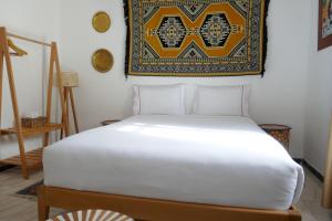 A bed or beds in a room at chez Aissam