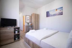 Postel nebo postele na pokoji v ubytování Hotel Princ