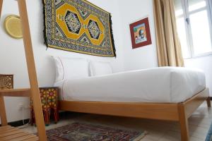 A bed or beds in a room at chez Aissam