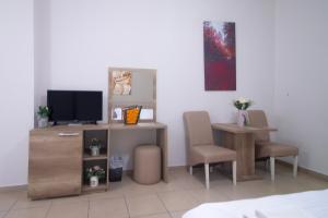 TV a/nebo společenská místnost v ubytování Hotel Princ