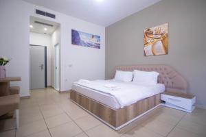 Postel nebo postele na pokoji v ubytování Hotel Princ