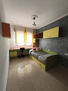 a bedroom with a bed and a desk in it at Casa O Con in O Grove