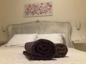Postel nebo postele na pokoji v ubytování Antica Novi B & B