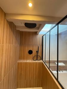 a staircase in a house with wood paneling at Le Nid de Plumetot - Maison de Charme en Normandie in Plumetot +36 photos