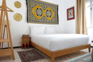 A bed or beds in a room at chez Aissam