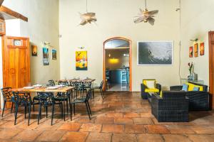 a dining room with a table and chairs at Hotel Plaza Marbella Granada in Granada