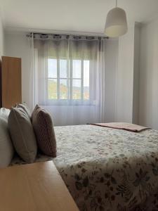 Posteľ alebo postele v izbe v ubytovaní PISO MOAÑA