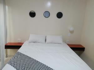 Postel nebo postele na pokoji v ubytování Papas Hotel Ga Marishane