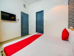 Postel nebo postele na pokoji v ubytování Hotel O Unique Delhi Home Stay