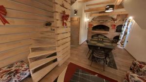 a room with a wooden wall with a fireplace at Villa Old Town Vlašić in Šišava +31 photos