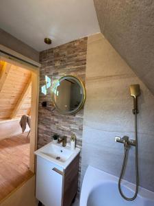a bathroom with a sink and a mirror at Cottage Lana 2 in Jajce +36 photos