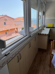 Η κουζίνα ή μικρή κουζίνα στο Apartman Relax +24 φωτογραφίες