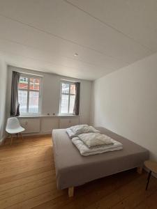 Postel nebo postele na pokoji v ubytování Grøn Odense Central