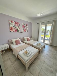 Postel nebo postele na pokoji v ubytování Sungate Villas