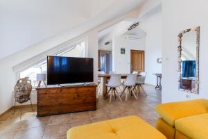 TV a/nebo společenská místnost v ubytování Villa Marin - 4 apartments