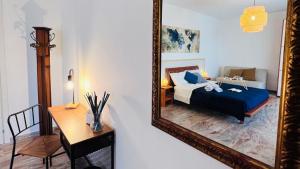 a bedroom with a bed and a mirror at Stella dei Venti B&B in San Salvo