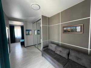 a living room with a couch and a wall at VIP HOTEL ZATOKA in Zatoka