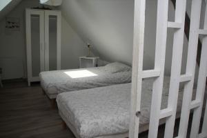 Ένα ή περισσότερα κρεβάτια σε δωμάτιο στο Duplex Romantique à Mastaing