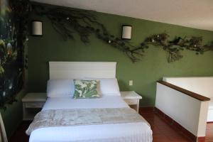 Postel nebo postele na pokoji v ubytování Hotel Mythos