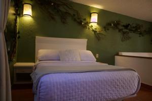 Postel nebo postele na pokoji v ubytování Hotel Mythos