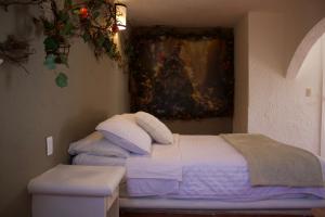 Postel nebo postele na pokoji v ubytování Hotel Mythos