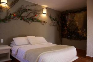 Postel nebo postele na pokoji v ubytování Hotel Mythos