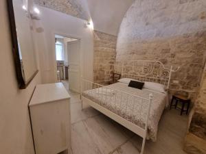 Ένα ή περισσότερα κρεβάτια σε δωμάτιο στο DAMA