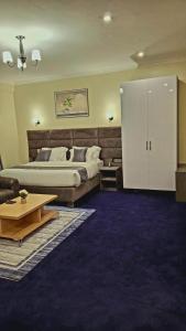 Postel nebo postele na pokoji v ubytování Calian hotel