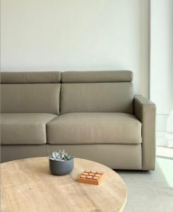 a living room with a couch and a table at Duchesse Luxe Cap - Naturiste in Cap d'Agde