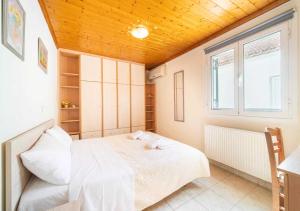 Postel nebo postele na pokoji v ubytování VILLA THEO