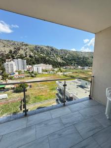 a balcony with a view of a city at 9apartaments Shengjin in Shëngjin